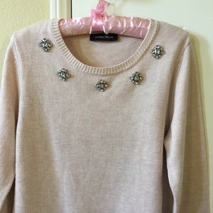 Pink sweater with crystal necklace